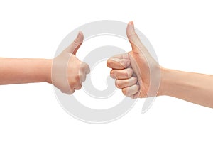 Hand of young girl and kids hand gesture, shows thumbs up. Isolated on white background