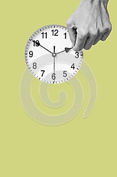 Man resets a clock backward or forward photo