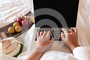 The hand of Young woman Sit play laptop In a luxurious room Ready Fruit