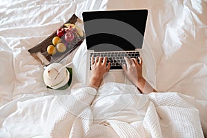 The hand of Young woman Sit play laptop In a luxurious room Ready Fruit