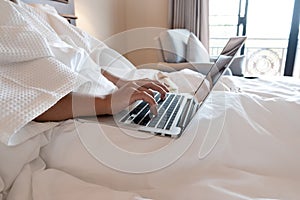 The hand of Young woman Sit play laptop In a luxurious room Ready Fruit