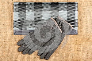 Handbag and gloves isolated on linen background.