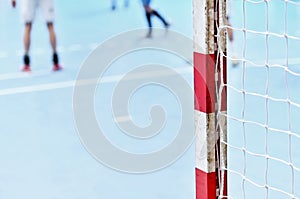 Handball goalpost with players in background