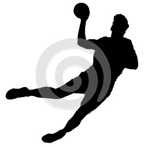 Handball player as silhouette isolated while shooting a throwing a ball
