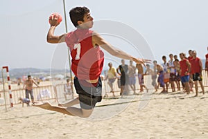 Handball player jumping with the ball