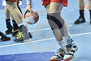 Handball player`s hand with the ball photo