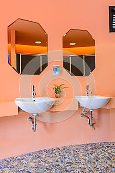 Handbasin and mirror in toilet