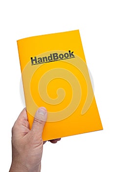 Holding a yellow HandBook photo