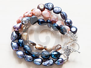 Handcrafted bracelet from colored river pearls