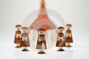 Handcrafted Carolers with white background, produced in Erz Mountains, Germany photo