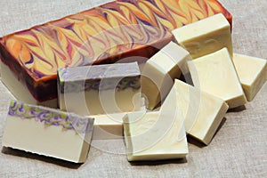 Handcrafted castile and bastille soap blocks and bars on display