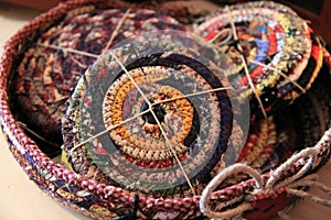 Handcrafted coasters in woven basket