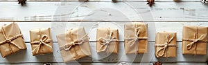 Handcrafted Eco-Friendly Gift Boxes on White Wooden Background with Copy Space for Text