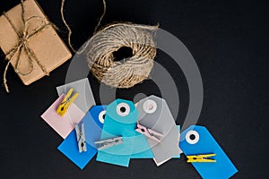 Handcrafted gift boxes wrapped in Craft paper with  paper card tag, rope and wooden clothespins for decoration