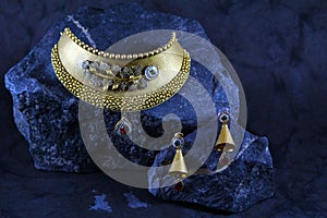 Handcrafted gold necklace with blue gems