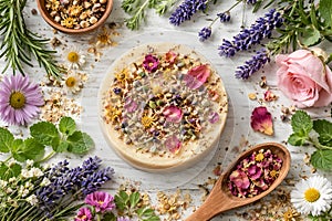 Handcrafted Herbal Soap Surrounded By Flowers On White Rustic Background