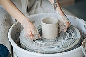 Handcrafted on a potter`s wheel,Hands make clay from various items for home and sale in the store and at the exhibition