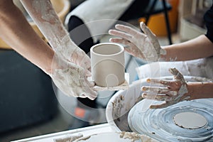 Handcrafted on a potter`s wheel,Hands make clay from various items for home and sale in the store and at the exhibition