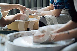 Handcrafted on a potter`s wheel,Hands make clay from various items for home and sale in the store and at the exhibition