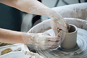 Handcrafted on a potter`s wheel,Hands make clay from various items for home and sale in the store and at the exhibition