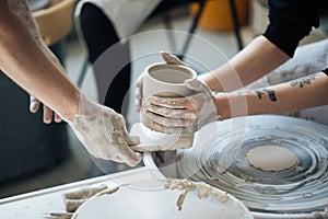 Handcrafted on a potter`s wheel,Hands make clay from various items for home and sale in the store and at the exhibition