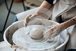 Handcrafted on a potter`s wheel,Hands make clay from various items for home and sale in the store and at the exhibition