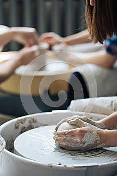 Handcrafted on a potter`s wheel,Hands make clay from various items for home and sale in the store and at the exhibition