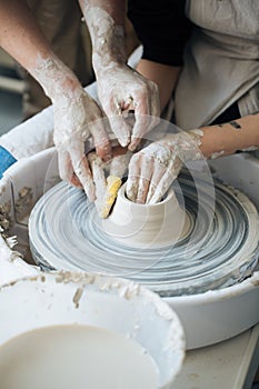 Handcrafted on a potter`s wheel,Hands make clay from various items for home and sale in the store and at the exhibition