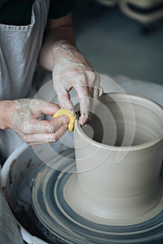 Handcrafted on a potter`s wheel,Hands make clay from various items for home and sale in the store and at the exhibition