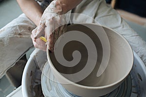 Handcrafted on a potter`s wheel,Hands make clay from various items for home and sale in the store and at the exhibition