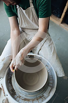 Handcrafted on a potter`s wheel,Hands make clay from various items for home and sale in the store and at the exhibition