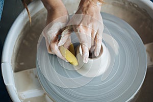 Handcrafted on a potter`s wheel,Hands make clay from various items for home and sale in the store and at the exhibition, ceramic i