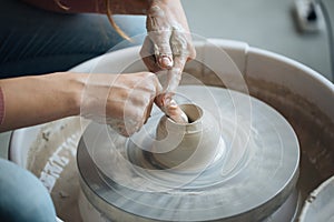 Handcrafted on a potter`s wheel,Hands make clay from various items for home and sale in the store and at the exhibition, ceramic i