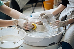 Handcrafted on a potter`s wheel,Hands make clay from various items for home and sale in the store and at the exhibition