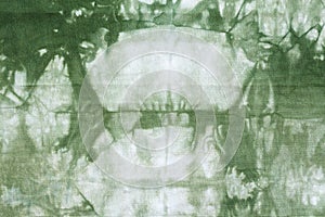 Handcrafted Shibori green abstract pattern photo