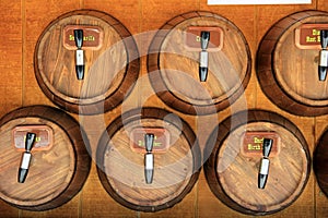 Handcrafted wood barrels titled with sodas