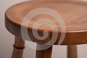 Handcrafted wooden backless stool on white background isolated