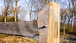 Handcrafted wooden fence with mortise and tenon joints photo