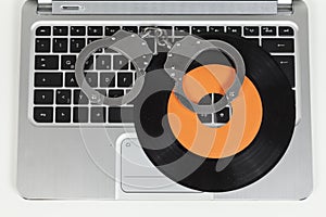 Handcuff and record on laptop