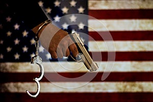 Handcuffed hand in front of the country flag. crime concept