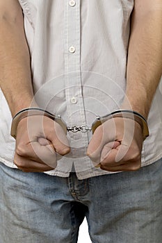 Handcuffed man isolated over white