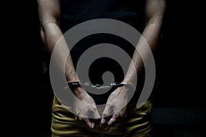 Handcuffed on a prisoner, Male prisoners were handcuff in the dark prison