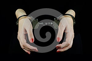 Handcuffed woman hands