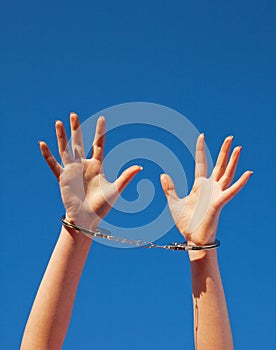 Handcuffed woman's hands