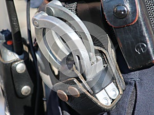 Handcuffs at the belt of a police officier in the Netherlands as general equipment.