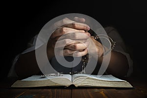 Handcuffs and the Holy Bible. Concept Picture of Someone Who Rel