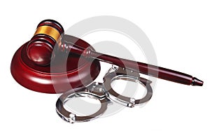 Handcuffs and Judge Gavel isolated on white