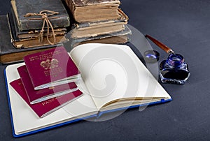 Handcuffs, passport and notebook on the table. Accessories on the desk at the police station