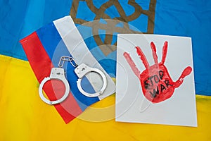 Handcuffs on the Russian flag look from above as a symbol of all the bad things that Russia