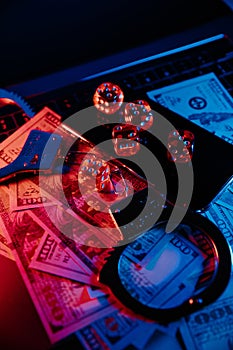 Handcuffs, smartphone and dice. Online casino concept. Vertical image